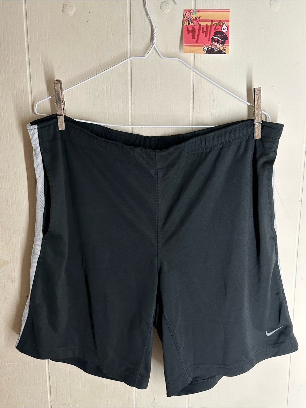 Nike Black Athletic Shorts with White Side Panels and Swoosh Logo